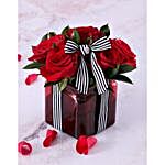 Red Roses In Red Vase