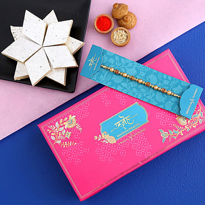 Traditional Golden Pearl Rakhi And Kaju Katli