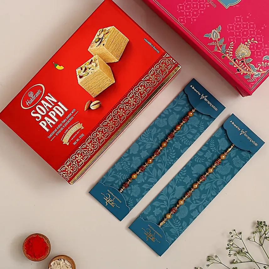 Traditional Pearl Studded Rakhi Set And Soan Papdi