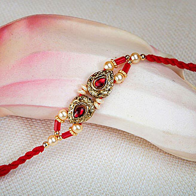 Pretty Golden And Red Rakhi uae | Gift Pretty Golden And Red Rakhi- FNP