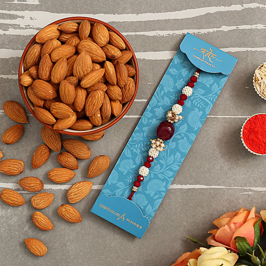Red Beads Pearl Designer Rakhi And Healthy Almonds:Rakhi With Dry fruit Hampers