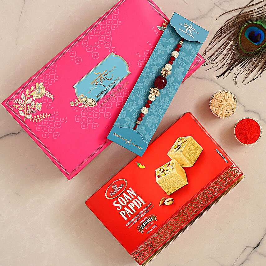 Red Beads Pearl Designer Rakhi And Soan Papdi:Rakhi With Sweets to UAE