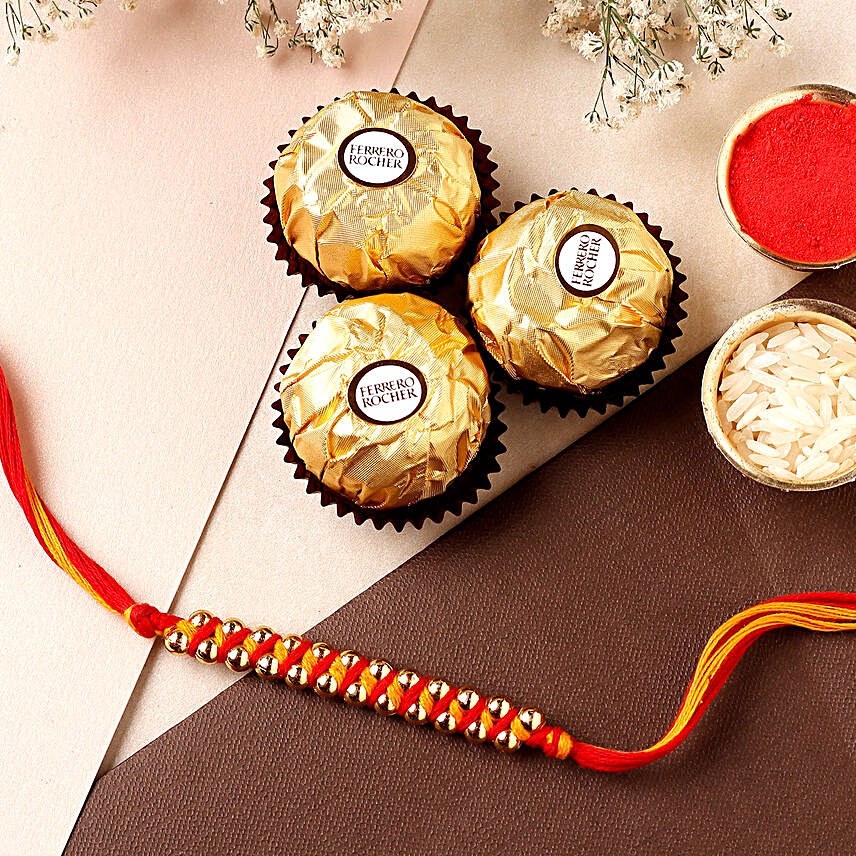 Sneh Gold Mauli Rakhi and 3 Ferrero Rocher:Rakhi With Chocolates to UAE