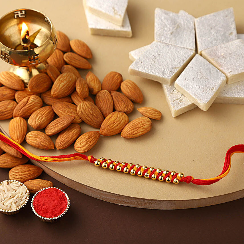 Sneh Gold Mauli Rakhi with 250 Grams Kaju katli and Almonds:All Rakhi - UAE