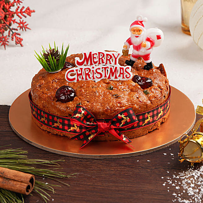 Plum Cake (Eggless), rich dry fruit cake baked without eggs, decorated with nuts