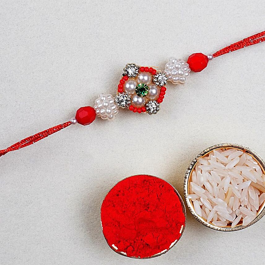 Appealing Floral Rakhi And 12 Pcs Ferrero Rocher