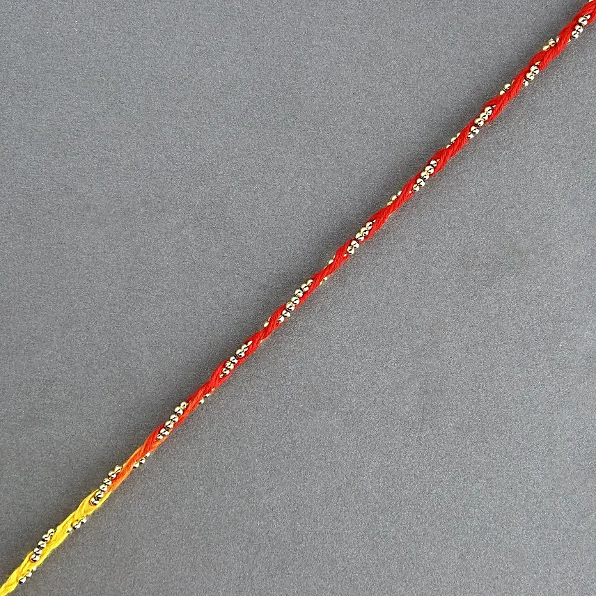 Sacred Bead Work Mauli Rakhi With 2 Fnp Chocolates