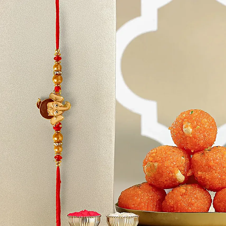 Long Trunk Bal Ganesha Pearl Rakhi For Kids And Motichoor Ladoo