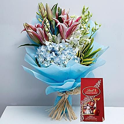 Delicate Flowers and Lindt Chocolate Combo:Flowers and Chocolates to Dubai