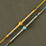 Sneh Vibrant Set Of 2 Pearl Rakhis with Lindt Bar