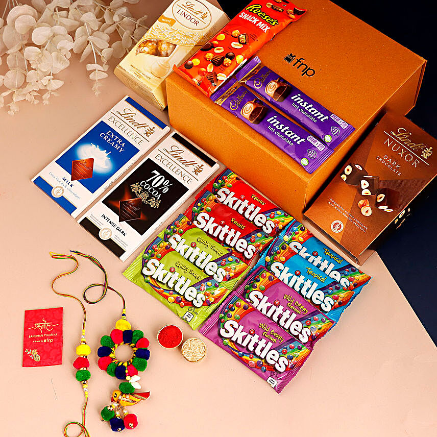 Sneh Pom Pom Bhaiya Bhabhi Rakhi Set & Chocolates:Send Rakhi With Gift Hampers To UK