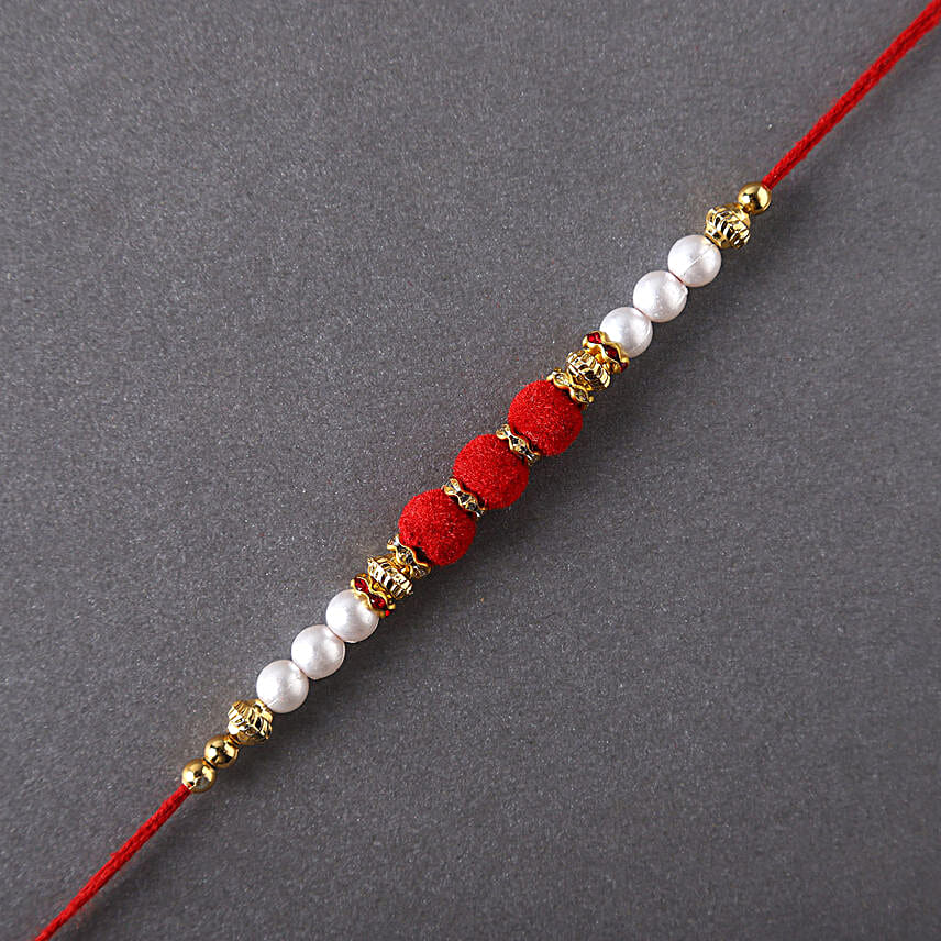 Sneh White Pearls Rakhi & Lindt Creation Dessert