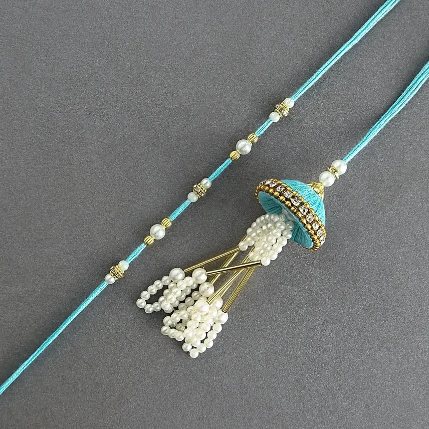 Tranquil Jhumar Bhaiya Bhabhi Pearl Rakhi Set N Milk Cake Delight