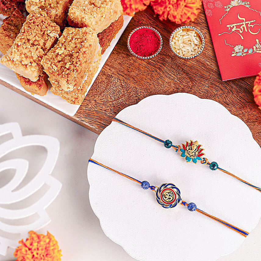 Vibrant Ganesh and Om Rakhi Duo N Milk Cake Delight