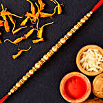 Traditional Pearl Mauli Rakhi And Healthy Almonds