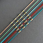 Understated Elegance Beads Rakhi Set & Kaju Katli Delight