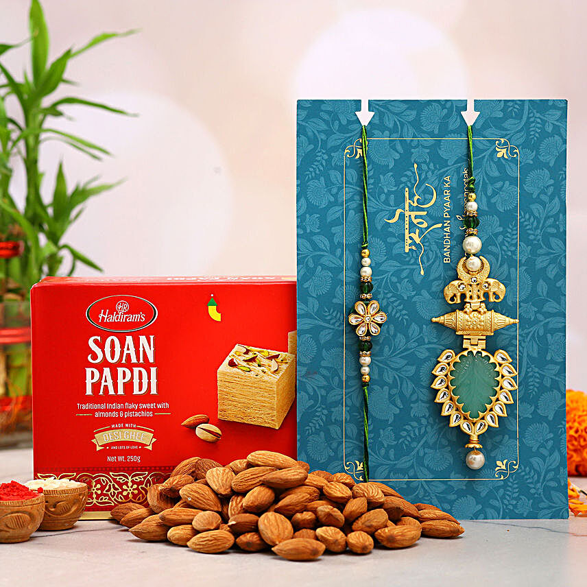 Ornamental Leaf Lumba Rakhi Set And Almonds With Soan Papdi