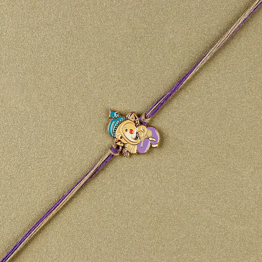 Bal Ganesha Cheerful Charm Rakhi N Laddoo Combo