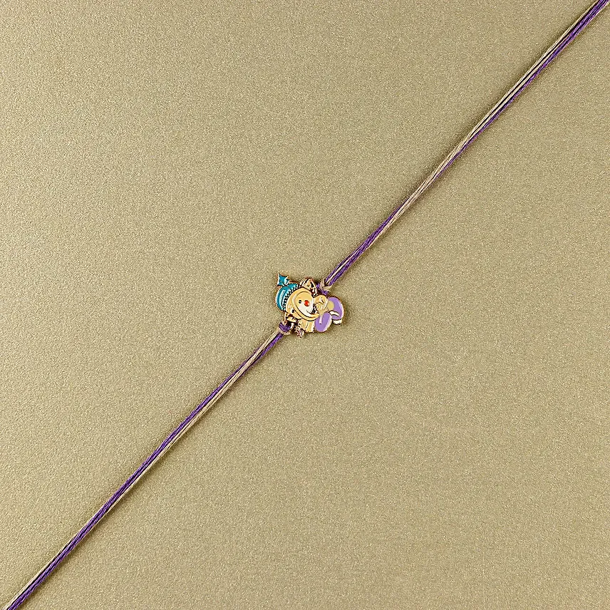 Bal Ganesha Cheerful Charm Rakhi N Laddoo Combo