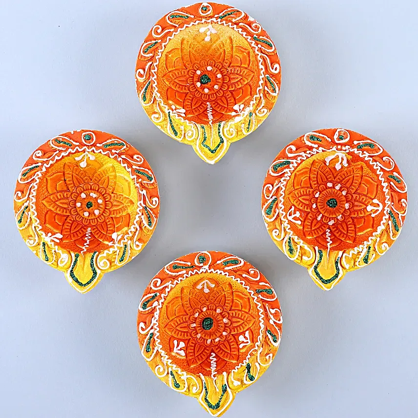 Designer Diyas With Almonds And Dhodha Burfi