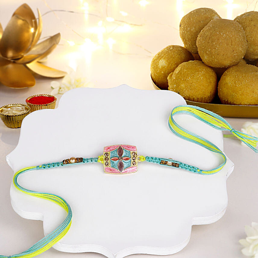 Floral Fantasy Rakhi N Besan Laddoo Delight