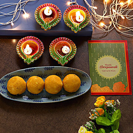 Floral Diyas With Greeting Card And Besan Laddoo:Send Diwali Sweets to USA