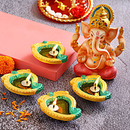 4 Mango Shaped Diyas & Pink Dhoti Ganesha Idol