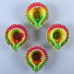 Floral Diyas With Greeting Card And Besan Laddoo